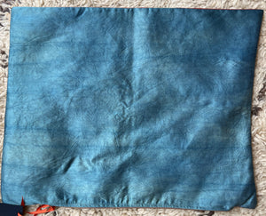 Rectangular Ottoman-style Suzani cushion with a central rosette, flowing saz leaves, and a tulip border.
