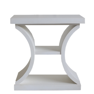 White side table with curved legs on a white background