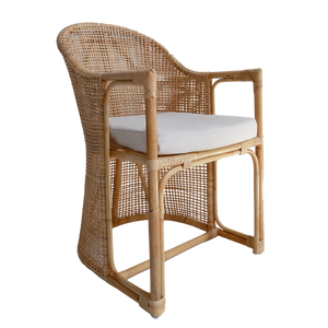 Wicker chair with a white cushion on a white background