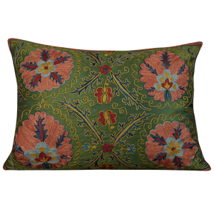 Rectangular silk suzani cushion with pink floral design on forest green ground