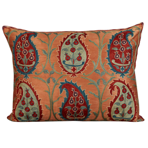 Rectangular silk suzani cushion with blue and red paisley design on pink ground