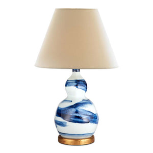 Hand-glazed ceramic lamp in a blue brush stroke glaze on a gold base by Bunny Williams Home