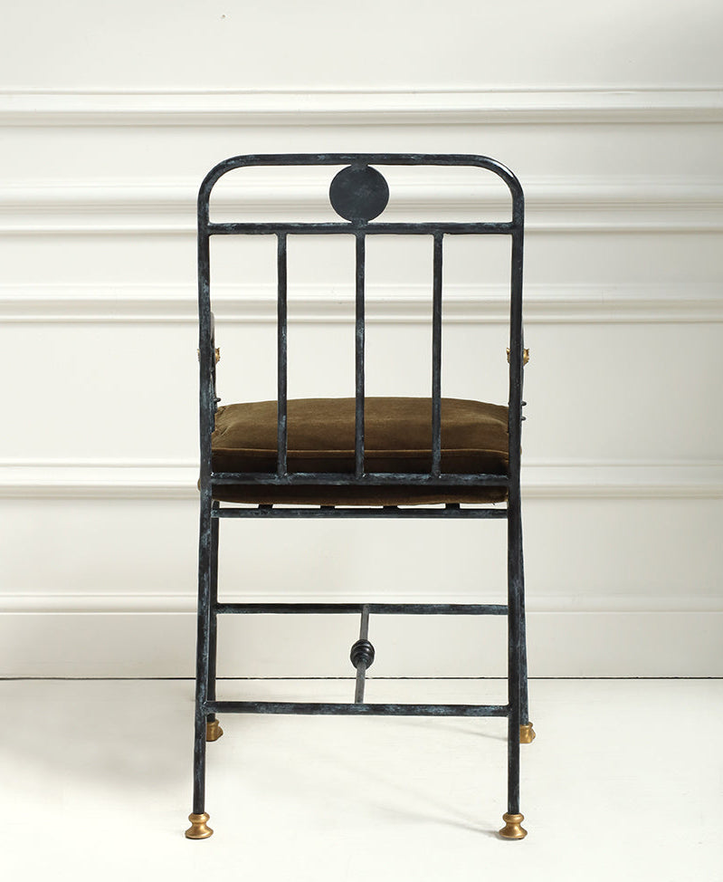 Black metal chair with a brown cushion on a white background