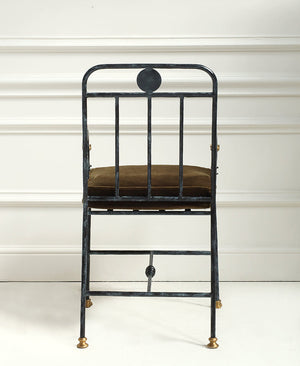 Black metal chair with a brown cushion on a white background