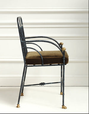 Vintage-style chair with metal frame and cushioned seat against a white background