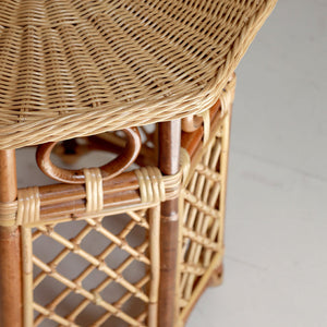 Close-up of a wicker table with a neutral background
