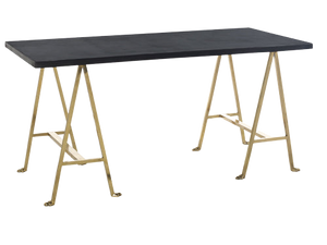 Table with black top and gold metal legs on a white background